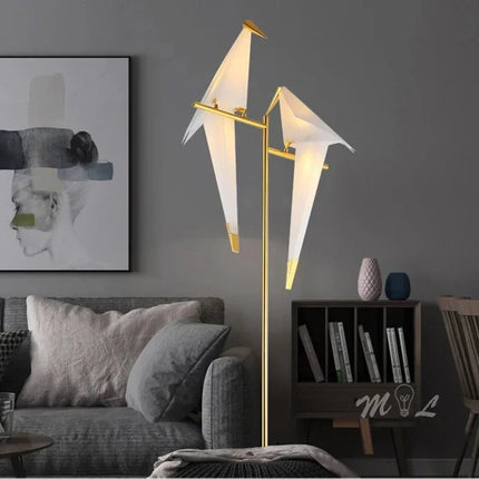 Lampadaire LED design oiseau en acier brossé, lumière chaleureuse d’intérieur - Luminous Place