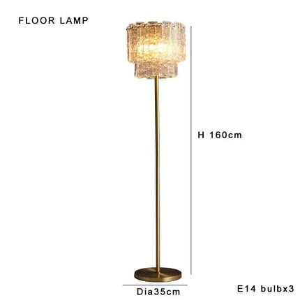 Lampadaire en laiton et verre transparent, lumière d'ambiance chaleureuse, design moderne - Luminous Place