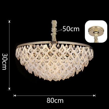 Lustre suspendu en cristal doré, design moderne, lumière chaleureuse pour salon et salle à manger