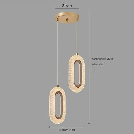 Suspension elliptique nordique en métal doré, lumière chaleureuse design 2025