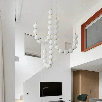 Suspension lampe perle haricot LED moderne en acrylique pour salon et escalier