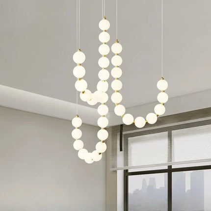 Suspension lampe perle haricot LED moderne en acrylique pour salon et escalier