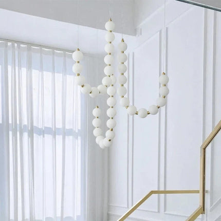 Suspension lampe perle haricot LED moderne en acrylique pour salon et escalier