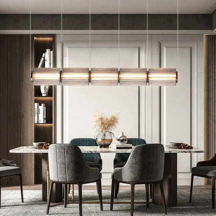 Suspension LED en verre gris et métal doré, design nordique lumineux