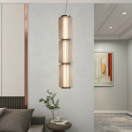 Suspension LED en verre gris et métal doré, design nordique lumineux