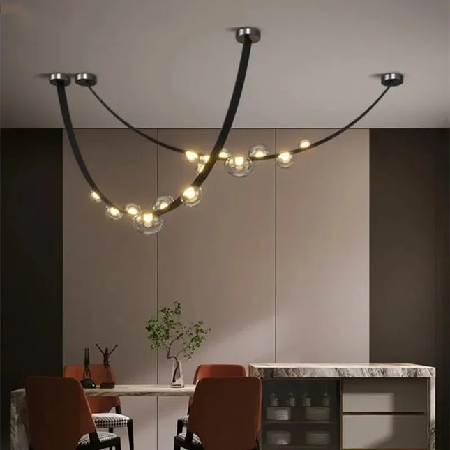 Suspension design nordique minimaliste en fer avec lumière LED chaleureuse